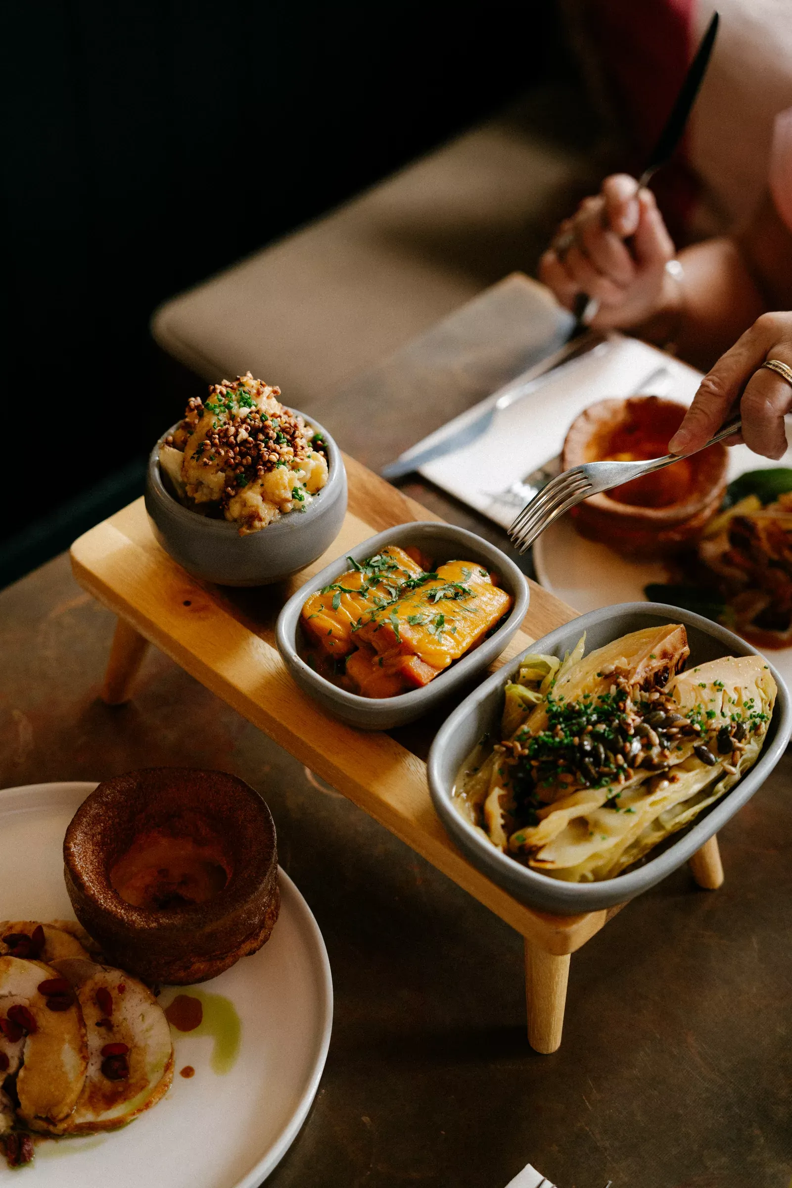 A Sunday roast sharing board of seasonal sides and a Yorkshire pudding at The Griffin