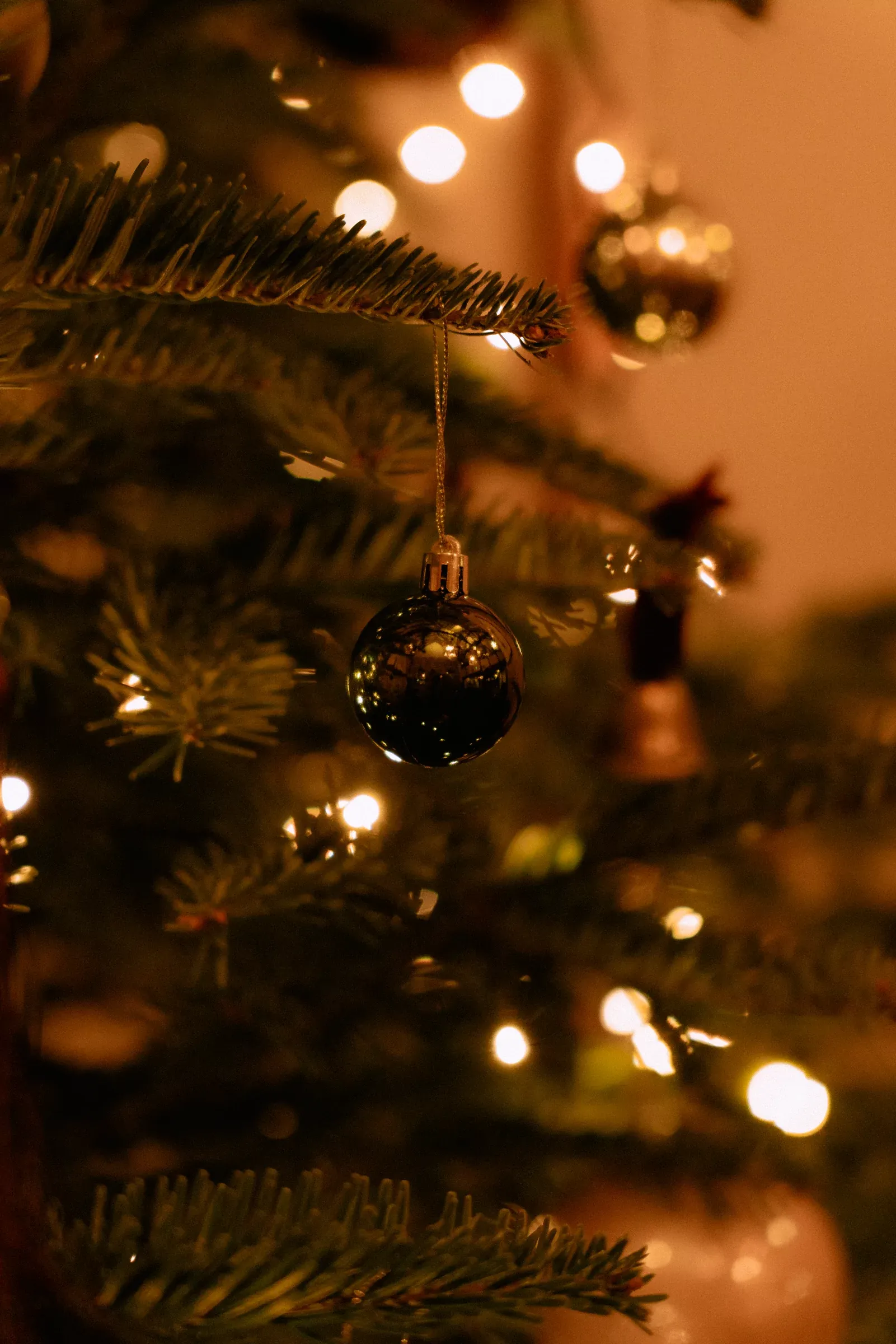 A bauble and warm lights on the Christmas tree at The Griffin